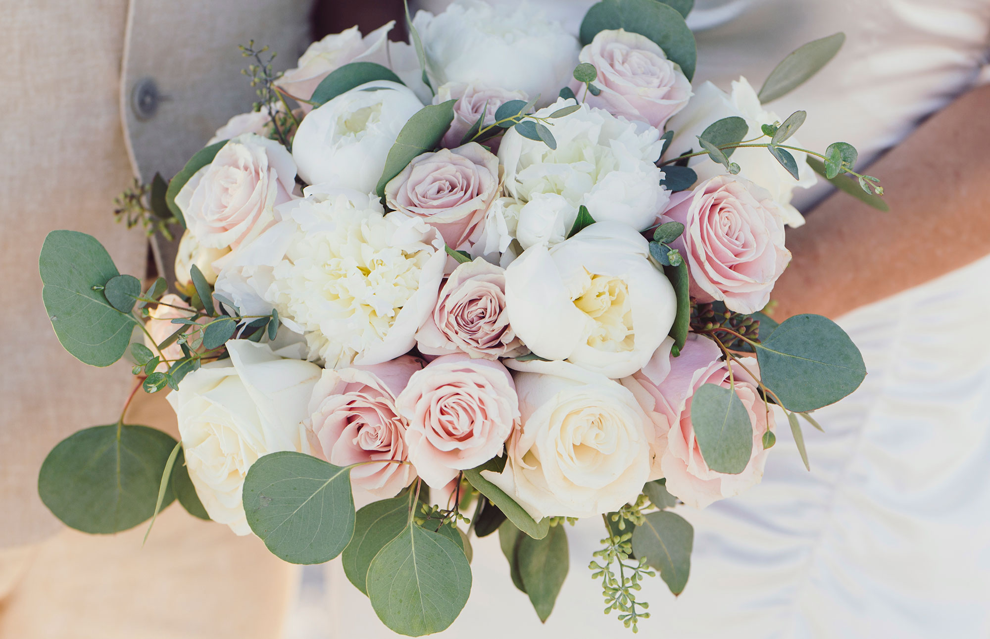 Bridal bouquet with white peony and pale pink roses