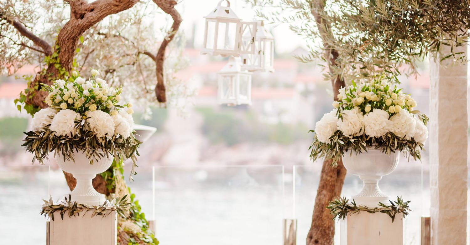 Photo of two flower arrangements framing for marriage proposal